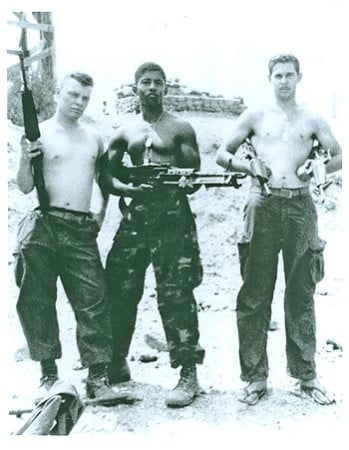 Corporal James “Sonny” Smith in Vietnam with members of his regiment.
