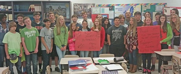 History instructor John Capone and his students at Cane Creek Middle School recently learned about the Tuskegee Airmen, the famed all-black WW2 bomber and fighter squadron. At the conclusion of the lesson the students honored the Airmen by creating 100 special handcrafted cards of appreciation.