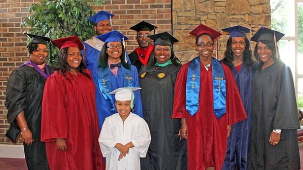 Front: Zion Lassiter (preschool graduate). Middle row (L-R): Donyele Proctor, Kelsey Redfern, Nashayla Petty, Kasheena Green, Promyss Watley, Ariel Edington, Taylor Feimster. Back row: Dominique Jamerson, Elder Alfred E. Blount. Not pictured, Teresa Jenkins. Photo: Urban News