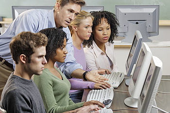 Instructor with Students in Computer Lab