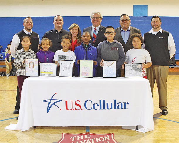 Front row, (L-R): Nicole Sanchez, Kiarra Plummer, Kaiden Thomas, Jeremiah Tolbert, Omar Tavares-Zaragoza, and Coe Perez. Back row: Dustin Neighbor, U.S. Cellular store manager; Kellen Griffin, U.S. Cellular business development manager; Haley Shealy, executive director, Salvation Army Boys & Girls Club; Cecil Bothwell, Asheville City Council; Jim Clark, U.S. Cellular area sales manager; Nick Deyton, U.S. Cellular store manager.  Photo: Paula Roberts