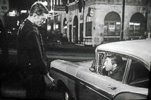 Luke (Robert Mitchum) speaking to  his brother Robin (James Mitchum) for the last time – looking up North Market Street. Photo courtesy of Park Circus