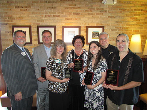 Pictured Left-Right: David Gantt, speaker; Herman Turk, GM-Renaissance Hotel (ARC Sponsor); Dounla Bennett, Treasurer and Volunteer honoree; Lisa Stevens, Teacher of the Year, Asheville City Schools; Virginia Ostgaard, Teacher of the Year, Buncombe County Schools; Buncombe County Sheriff Van Duncan, Master of Ceremonies; Chris Cassels, Volunteer, ARC of Buncombe County. Not pictured: Isabel Fraga, Operation Santa Supporter and Volunteer; and Alfred Whitesides, Chairman.