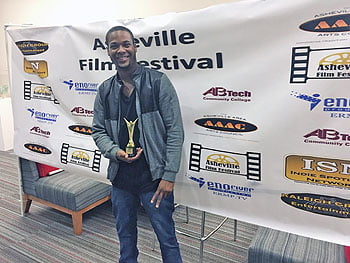 Best Supporting Actor Austin Frye with his award for his role in In Critical Condition. 