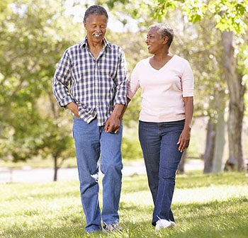 older couple walking in park