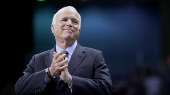 U.S. Republican presidential nominee Senator John McCain listens as he is introduced at a campaign rally in Fayetteville