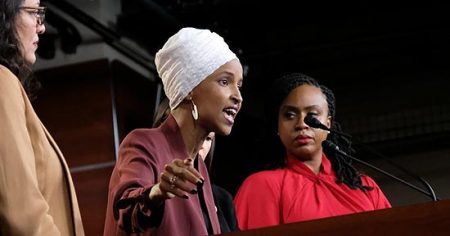Rep. Ilhan Omar (D-MN) speaks as Reps. Ayanna Pressley (right) and Rashida Tlaib (on the left) listen during a news conference in Washington, DC. Photo: Alex Wroblewski