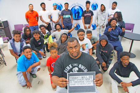 Keynon Lake with youth from his nonprofit organization, My Daddy Taught Me That.