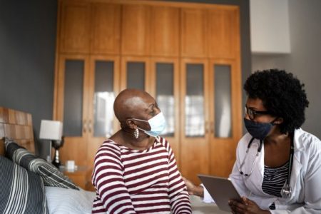 black-doctor-and-patient-wearing-masks