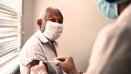 elder receives vaccination