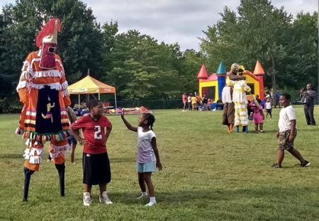 stilt walkers in park