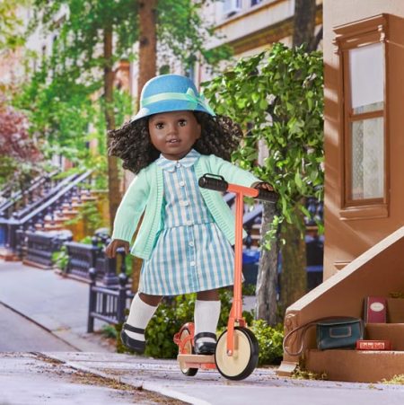Claudie Wells doll on scooter
