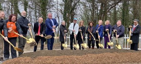 Representatives from the City of Asheville, Shangri-La, and Step Up break ground for the supportive housing project.