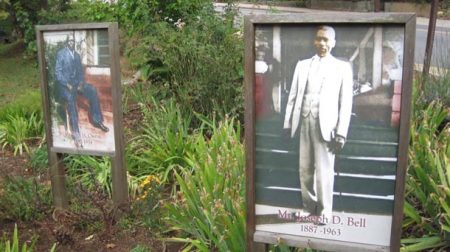 Photos of John H. Owens (left) and Joseph D. Bell can be seen from the sidewalk along Clingman Avenue and the paved path in the park.