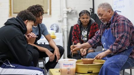 Local high school students learn the art of pottery from world-renowned potter Jim McDowell, (right). Photo: Robbie Francis