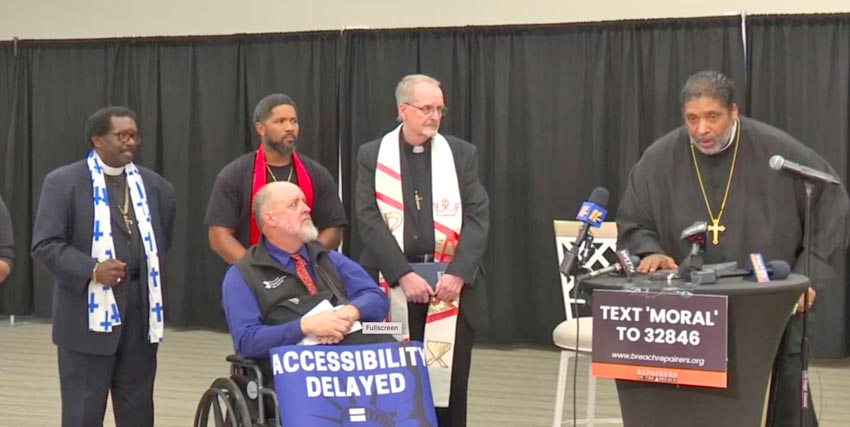 Bishop William Barber holds a news conference days after police escorted him out of a Greenville movie theater because he brought his own chair.