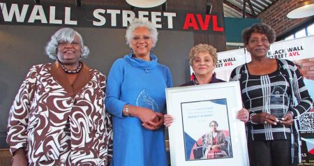 MLK Jr. Association Founder Dr. Oralene Graves Simmons holds a plaque honoring the 2024 Rosa Parks awardees (L-R): Renee White, Becky Stone, and Johnnie N. Grant. Photo: Renato Rotolo/Urban News