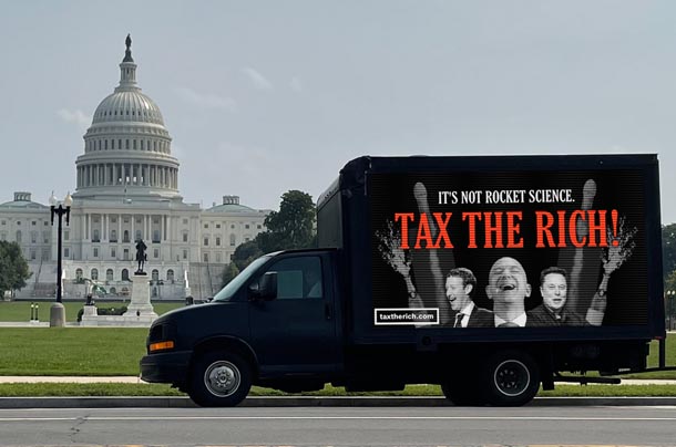 tax the rich truck with sign