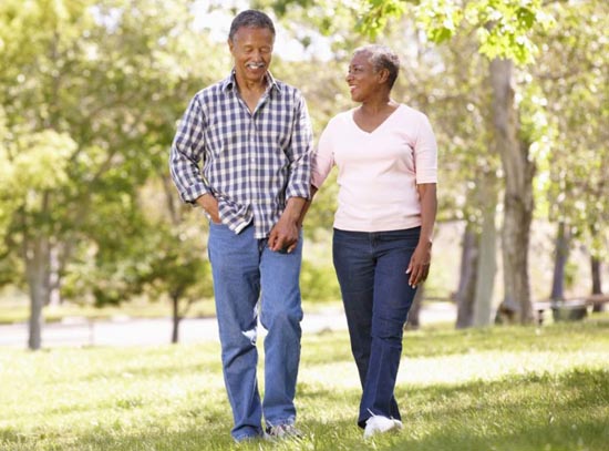 older couple walking in a park