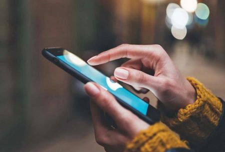 hand touching phone screen