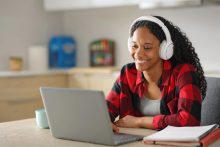 Black student e-learning in the kitchen