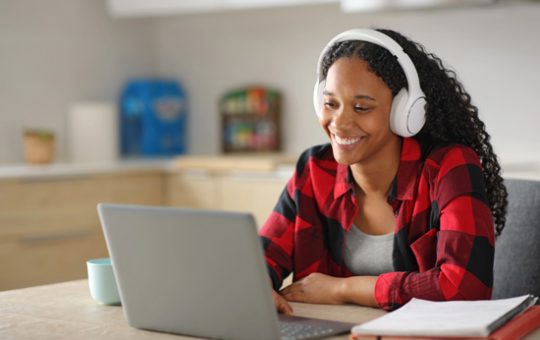 Black student e-learning in the kitchen