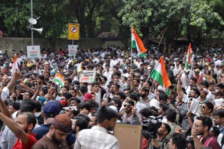 Student protestors call for the resignation of Dharmendra Pradhan, India’s education minister.