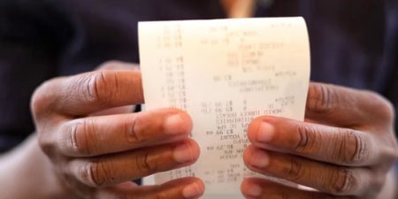 black consumer with receipt lrg