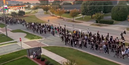 students marching to vote