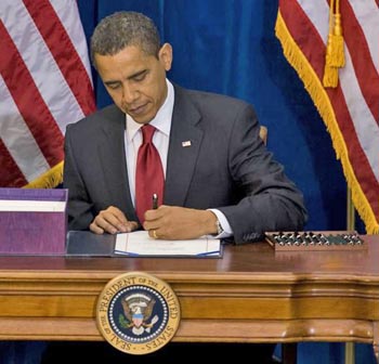 obama_signs_bill.jpg